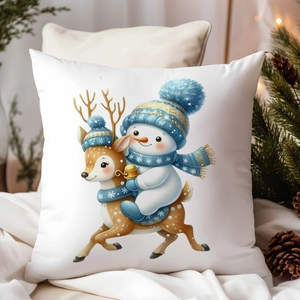 Détail de la housse de coussin de Noël blanche avec motif festif de bonhomme de neige