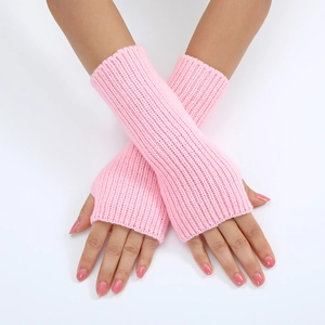 Detail of pink knitted fingerless gloves with a striped pattern on a model