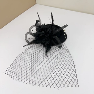 Close-up of black mesh fascinator with elegant feathers, fabric flower and white pearls