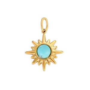 Macro detail of golden sunburst pendant with turquoise gemstone and radiating lines