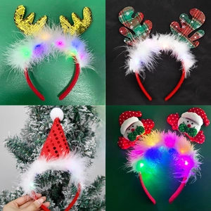 Detail showing four styles of LED Christmas headbands with sequins and festive antlers