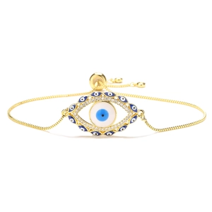 Detail of adjustable gold-plated box chain with enamel evil eye and sparkling zircons