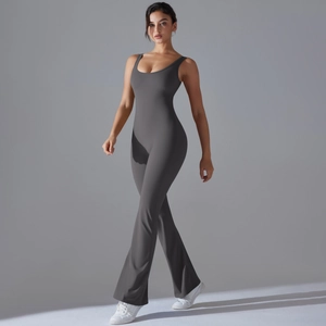 Detail view of high-stretch dark grey flare leg yoga jumpsuit with professional stitching