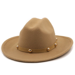 Detail of camel wool felt hat featuring a classic brim and gold cylindrical metal studs