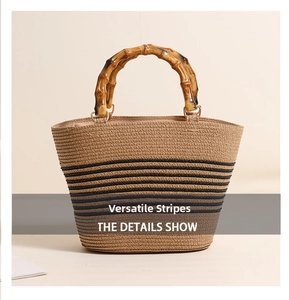 Detail of woven straw bag with bamboo handle and elegant dark horizontal stripes