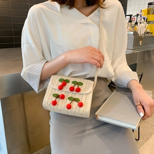 Chic cream straw woven crossbody bag with cute cherry 3D embroidery detail for women