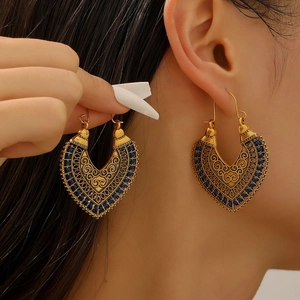 Retro bohemian hollow floral totem earrings with blue beads in antique gold finish
