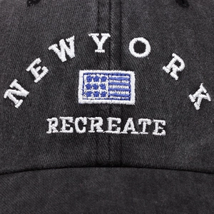 Black washed cotton baseball cap with New York embroidery and vintage flag design