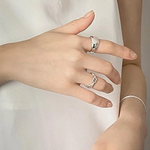 Detail showing minimalist 925 sterling silver polished wide band and anchor chain ring