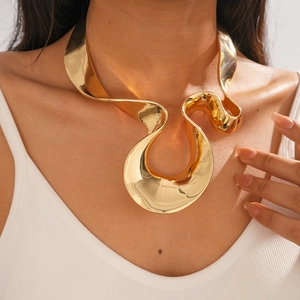 Detailed close-up of golden liquid-metal choker with irregular geometric distortion