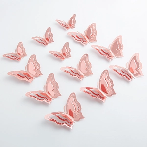 Pink and gold 3D layered butterfly wall stickers arranged in heart shape on white