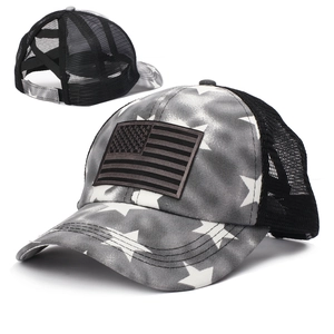 Detail of cross elastic bands on mesh back for ponytail on American flag trucker hat