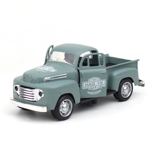 Detailed view of vintage diecast pickup truck toy with openable doors and printed logos