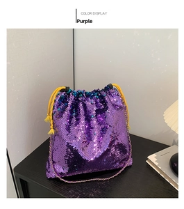 Detailed view of high-density purple sequins and yellow drawstring on bucket bag