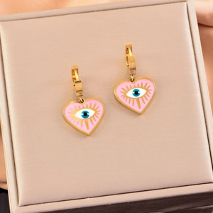 Golden heart evil eye earrings with pink enamel finish and bohemian protective charm
