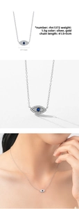 Macro detail of S925 sterling silver evil eye necklace with blue stone and white crystals