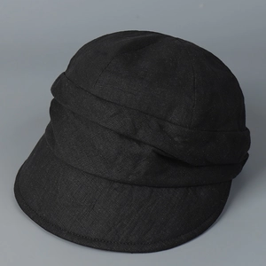 Detail of Japanese pleated linen newsboy hat in black with textured cotton-linen fabric