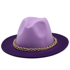 Close-up of dual-tone purple wool fedora hat with gold chain accent and wide brim