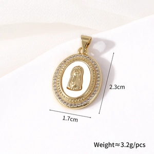 Close-up of gold-plated oval Virgin Mary pendant with mother-of-pearl and zircon bezel