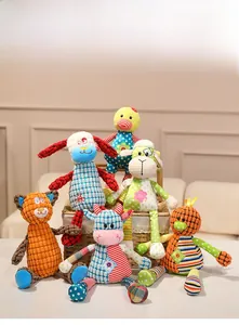 Close-up of baby pacifier plush dolls with mixed fabric textures and animal designs