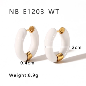 Detail view of white enamel and 18K gold earrings with 2cm diameter and 8.9g weight