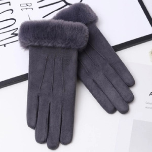 Detail showing thick faux fur trim and gray suede texture on warm winter gloves