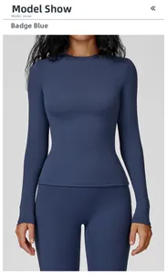 Detailed front view of emblem blue slim fit long sleeve yoga top and matching leggings