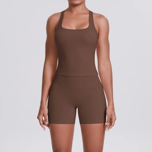 Detail of dark brown racerback yoga set featuring high waist shorts with side pockets