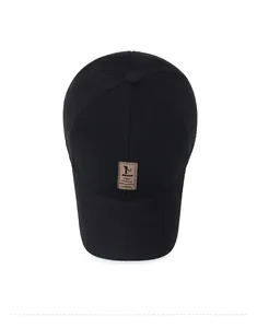 Top view of thick wool baseball cap with ear flaps and embossed leather patch detail