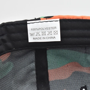 Detailed interior of camouflage baseball cap showing 100% polyester label and sweatband