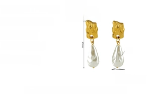 Detail of irregular baroque pearl earrings with hammered 18K gold-plated texture