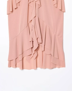 Macro shot of pink layered chiffon ruffles on an elegant sleeveless halter neck top