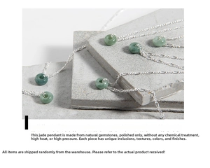 Macro shot of natural green jadeite stone texture and polished silver metal necklaces