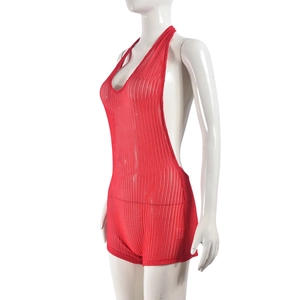 Detail of red hollow mesh fabric and crochet texture on a halter neck bodysuit