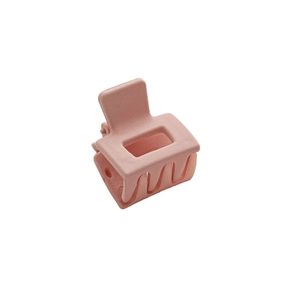 Matte pink square claw clip for hair with minimalist design on white background