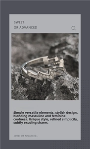 Macro shot of silver lightning ring with zircon insets on dark rock texture background