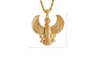 Macro detail of 47mm golden eagle pendant with zircon stones and 18K gold plating