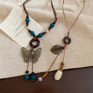 Bohemian style necklace set with hollow butterfly pendant and ethnic wooden beads
