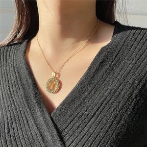 Minimalist gold stainless steel letter T pendant necklace with sparkling pavé stones