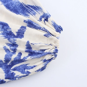 Maxi shirt dress with blue brushstroke print featuring elastic cuffs and cotton texture