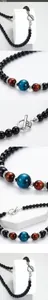 Detail of stainless steel OT clasp necklaces with tiger eye beads for men