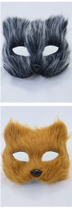 Close-up of fluffy long-haired fox and raccoon masks with realistic faux fur texture