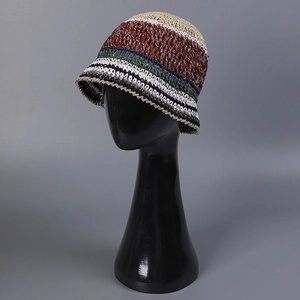 Detailed close-up of hand-woven striped straw bucket hat showing intricate texture