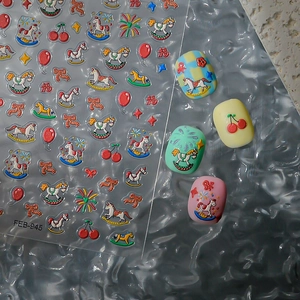 Detailed view of 3D embossed rocking horse nail stickers on colorful patterned manicures