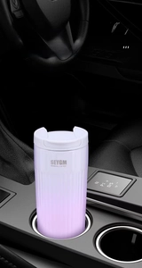 Detail of lavender matte coffee mug with white lid placed in a car cup holder