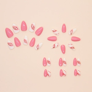 Faux ongles amande rose et à fleurs avec finition brillante style minimaliste