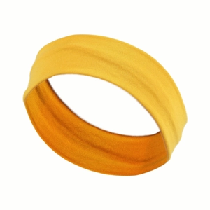 Close-up of yellow-orange elastic yoga headband with breathable fabric texture
