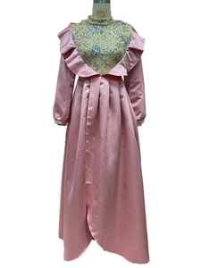 Close-up of pink evening gown with floral sequin embroidery and ruffled collar detail