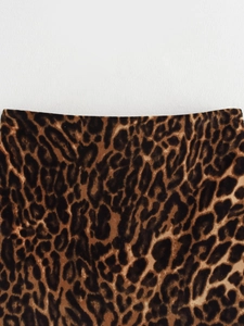 Close-up of soft leopard print fabric texture for women's blazer set in high detail