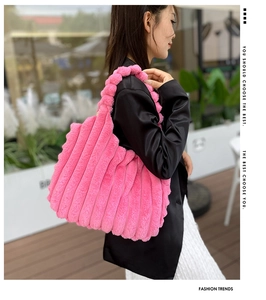 Pink striped faux fur tote bag with large capacity shown in a soft outdoor street style setting